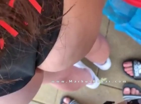 Fat guy try touching woman's ass wearing swimsuit in a beach bar